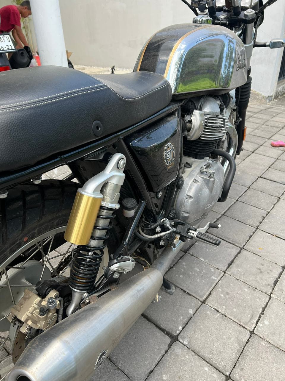Polished Royal Enfield chrome tank after SparkWash detailing in Bali